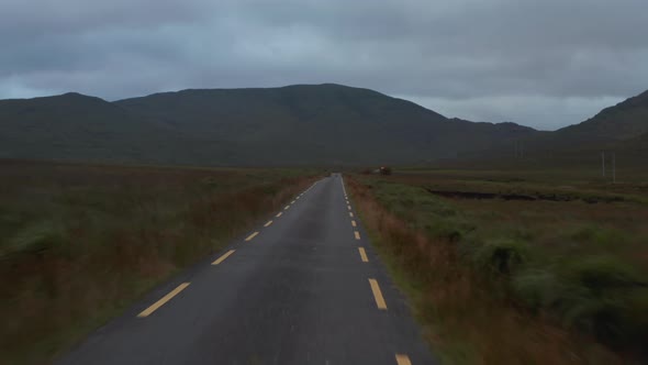 Low Flight Above Narrow Road with Dashed Lines on Side alt