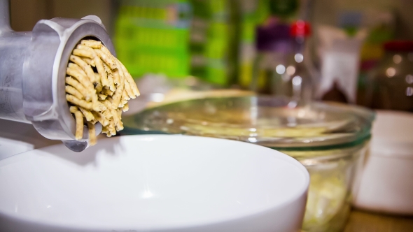 Mincer Machine In Action With Walnuts