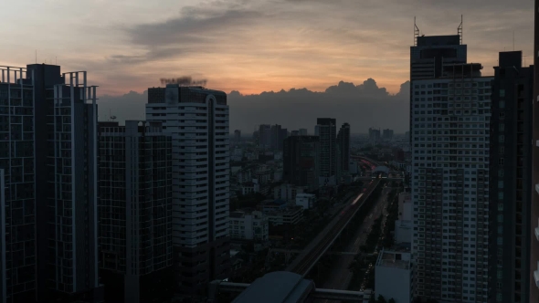 Cityscape With Skyscrapers, Buildings and Industrial Smog Under City on the Background alt