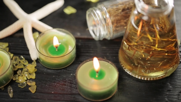 Green Candles in Spa Salon and Massage Oil