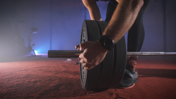 Young Athlete Coming To The Barbell, And Adds To It The Weight. alt