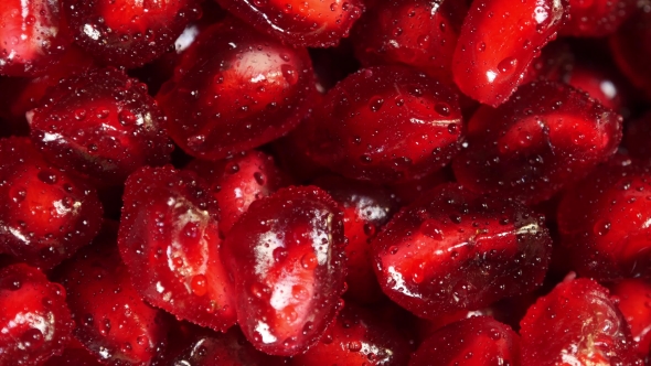 Rotating Fresh Pomegranate Seeds For Food alt