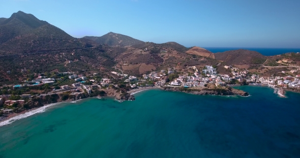 Flying Above Town By Seashore