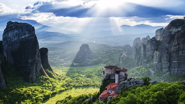 Great timelapse view of sunrays run over Meteora valley and Rousanou nunnery in Greece at day