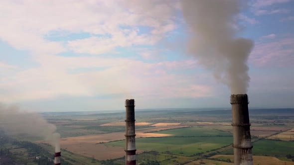 Aerial View of High Chimney Pipes with Grey Smoke From Coal Power Plant alt