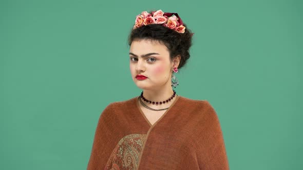 Beautiful Portrait of Woman with Thick Eyebrows Frida Kahlo Lookalike Wearing Jewelry and Roses in alt