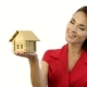 Happy Woman Holding a Little House In Her Hands - VideoHive Item for Sale