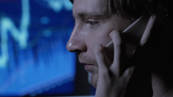 Stressed Businessman Working Overtime Late At Night  alt