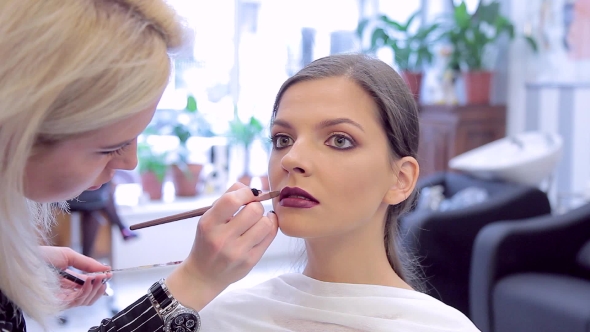 Make-up Artist Applying The Lipstick To Model's Make-up, Stock Footage