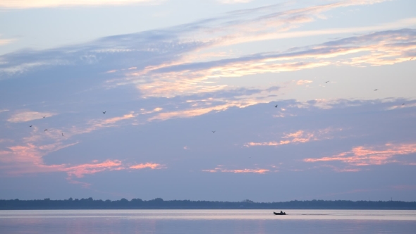 Motor Boat Moves Quickly On Lake Or River At Dawn