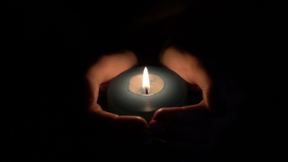 Footage Burning Candle In The Hands Of Women. alt