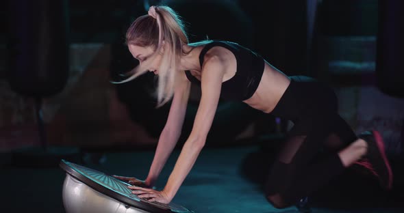 Young Woman Wearing Sportswear, Exercise, Stretch at Gym Modern Fitness Studio. alt