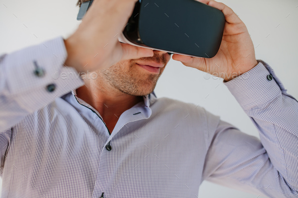 Male model wearing VR goggle - Stock Photo - Images