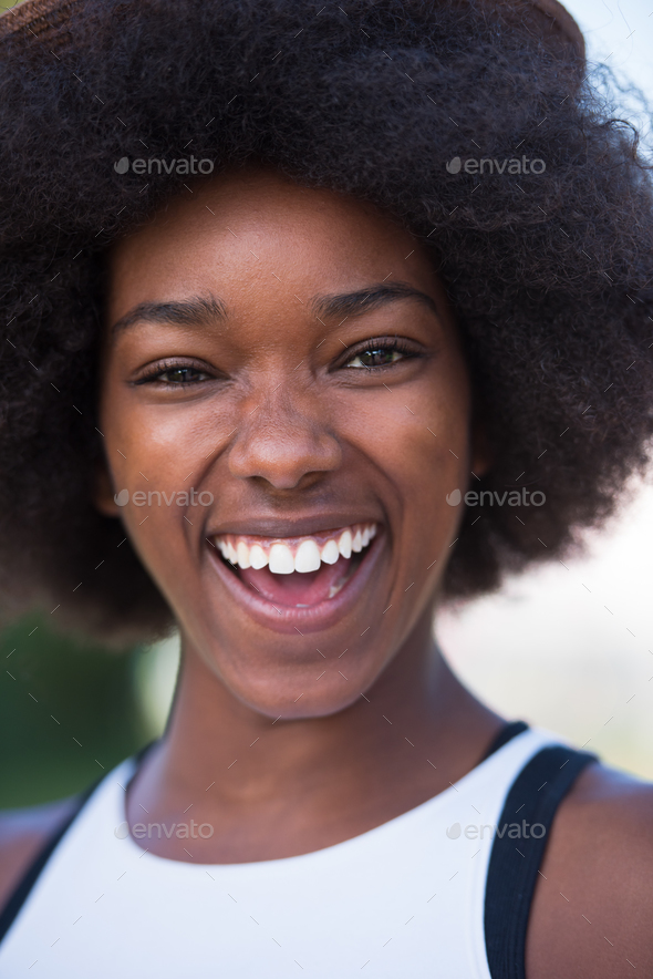 Close up portrait of a beautiful young african american woman sm - Stock Photo - Images