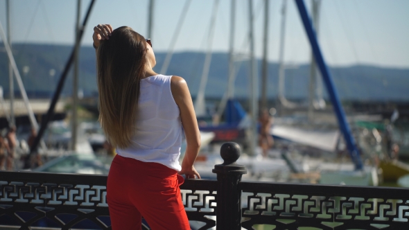 Woman At The Pier Near Yacht On The Background Of Blue Sky, Selective Focus alt