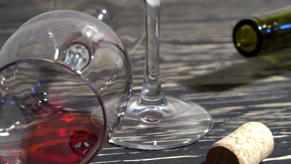 Corkscrew, Cork, Bottle And Glass Of Red Wine On a Wooden Table