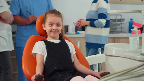 Portrait of Little Girl Patient Looking at Camera Waiting for Pediatric Stomatologist alt
