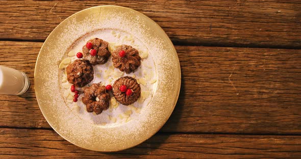Christmas cookies on plate with a glass of milk 4k alt