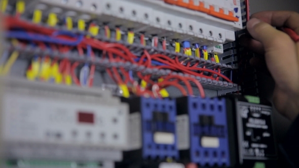 Electrician Testing Electrical Power. Industrial Factory Electrician Testing Voltage Using alt
