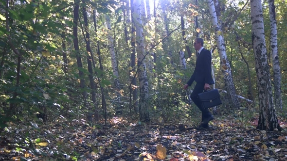 Businessman Playing In The Woods As a Child alt