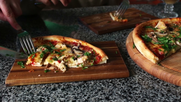 People Eat Large Pieces Of Hot Pizza alt