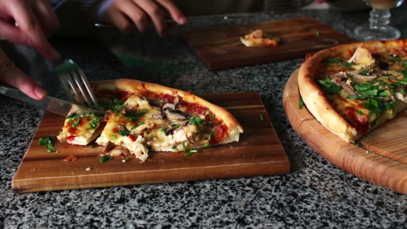 People Eat Large Pieces Of Hot Pizza alt