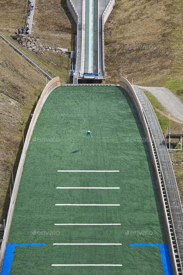 Ski jump. Artificial track. Sport background. Norwegian summer. Vertical Stock Photo by ABBPhoto