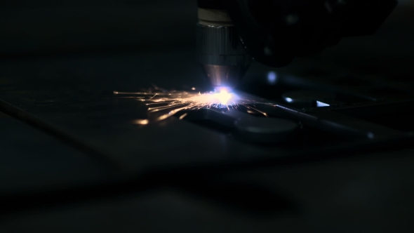 Plasma Laser Cutting Metal Sheet With Sparks alt