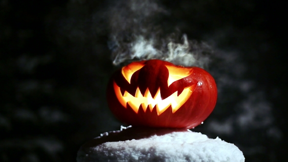 Halloween Pumpkins In The Winter Snowy Night With Overflying Ghost. Looped. alt