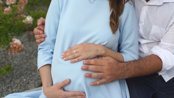Pregnant Couple Husband Touching His Wife Belly With Hands Stock Footage 