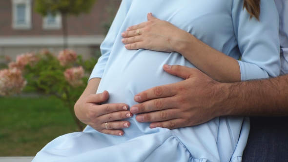 Pregnant Couple Husband Touching His Wife Belly With Hands Stock Footage 