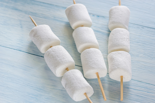 Marshmallow skewers on the wooden background Stock Photo by Alex9500