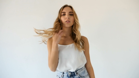 Young Model Girl In White Tank Top And Short Blue Jean Shorts, Stock Footage