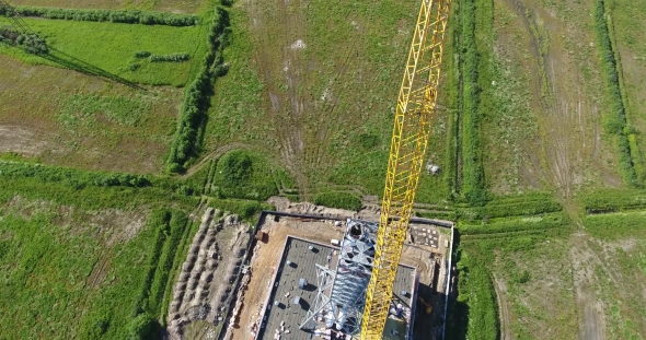 Crane Lift Chimney Pipe Segment. Аerial, Workers On The Top