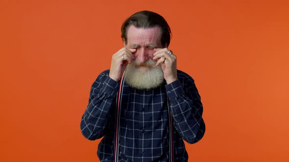 Disappointed Upset Elderly Old Man Wipes Tears and Cries From Despair Sad Because of Unfair Things alt