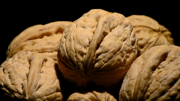 Walnuts Fruit Turning in a White Bowl alt