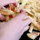 Mix spices with long raw fries potatoes by hands - VideoHive Item for Sale