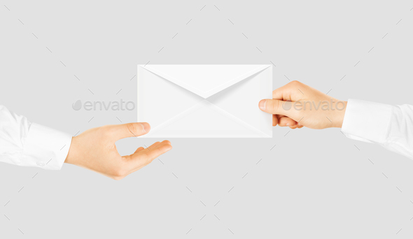 White blank envelope giving hand. Message send presentation. - Stock Photo - Images