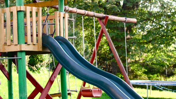 Children Playing On Slide