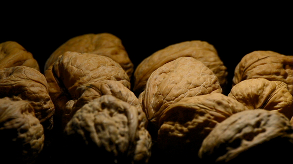 Walnuts Nuts Turning on Black Background alt