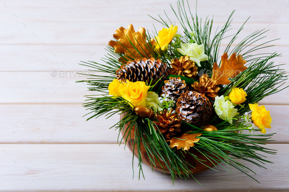 Christmas table decoration with pine branches and golden cones - Stock Photo - Images