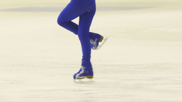 Slender Legs Of Girl Skater. Competitions In Figure Skating, Performance Of Young Athletes alt