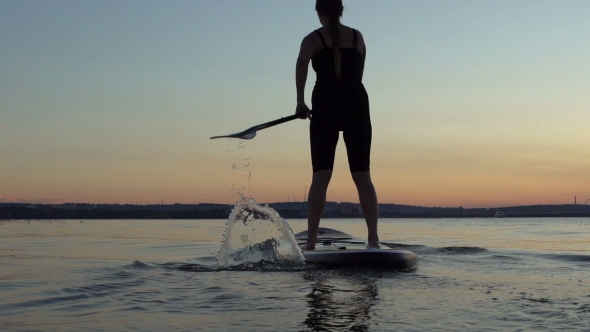 Beautiful Woman On Stand Up Paddle Board. SUP.