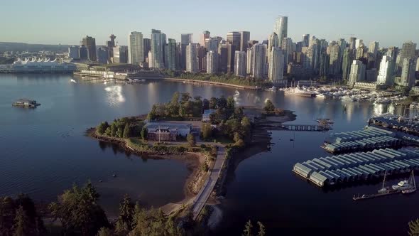 Downtown Skyline Of Coal Harbour And Deadman's Island From Brockton Point At Stanley Park In Vancouv alt