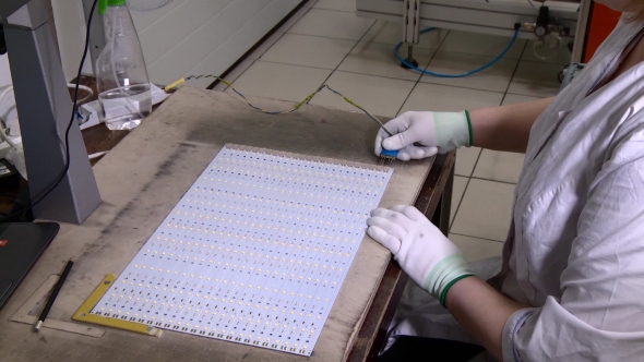 Worker Testing a LED Panel