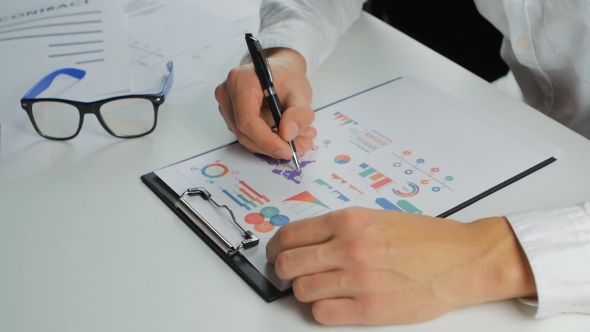 Businessman Developing a Business Project And Analyzing Market Data Information. alt