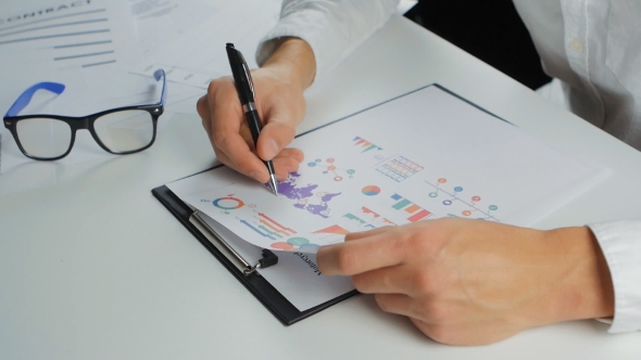 Businessman Developing a Business Project And Analyzing Market Data Information. alt