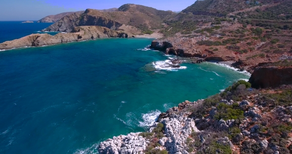 Blue Sea, Waves Breaking In Cliffs At Shore