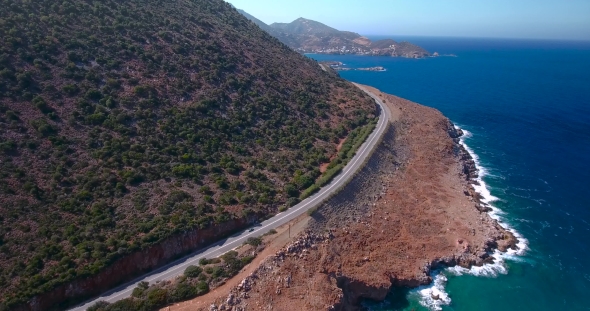 Flying Above Road By Seashore