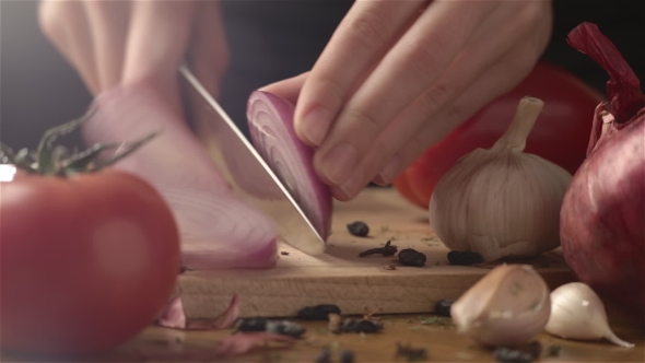 Female Hands Cutting Onion